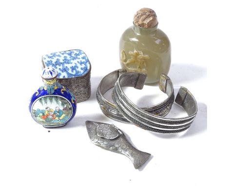 A Chinese relief carved hardstone snuff bottle, a Chinese painted enamel snuff bottle, bangles etc 
