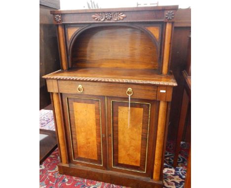 19th century rosewood cabinet, the top with arched shelf, the lower section with gadrooned borders and frieze drawer, pair of