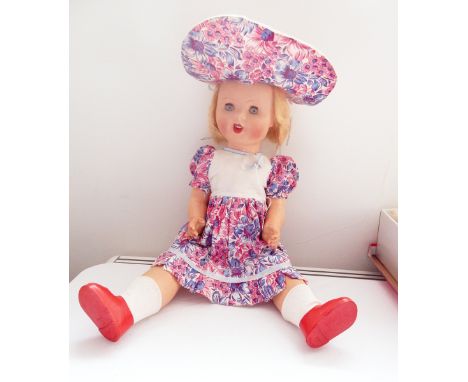 1950's/60's composite doll with speaker box in her back, with some vintage baby clothes 