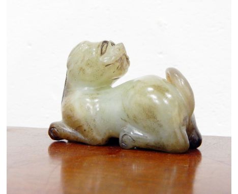 Carved Oriental jade model of a temple dog and a jade child's bangle (cracked) (2) 
