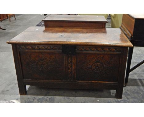 18th century oak coffer, the twin plank top with original staple hinges, the twin panel front with lozenge and rosette carvin