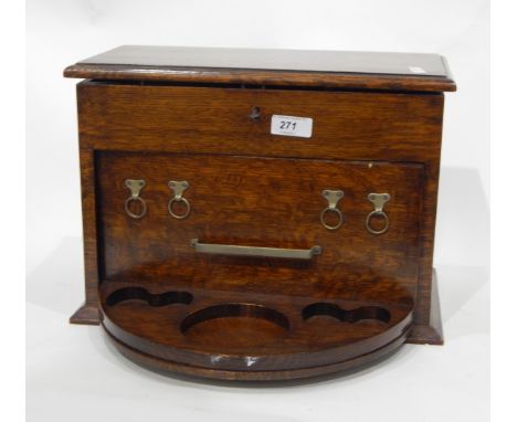 Early 20th century oak smoker's compendium set, the oak lift-top box with revolving section mounted with pipe hooks and stand