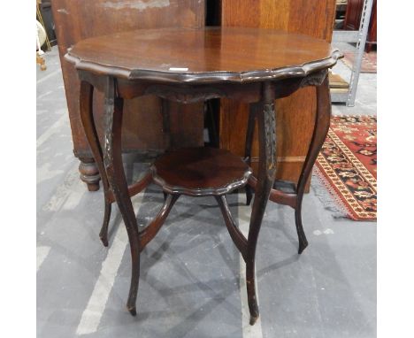 Walnut side table with wavy edge top, on cabriole supports with under-shelf, diameter 70cm 