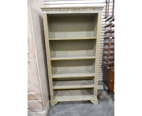 Grey painted open bookcase of four shelves, raised on bracket feet, width 86cm 