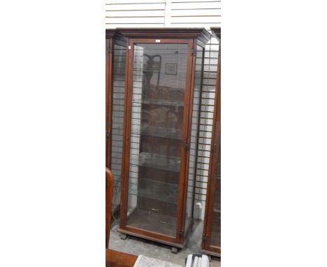 Glazed oak display cabinet with straight moulded cornice, glazed panel sides and door enclosing glass shelves, on block feet,