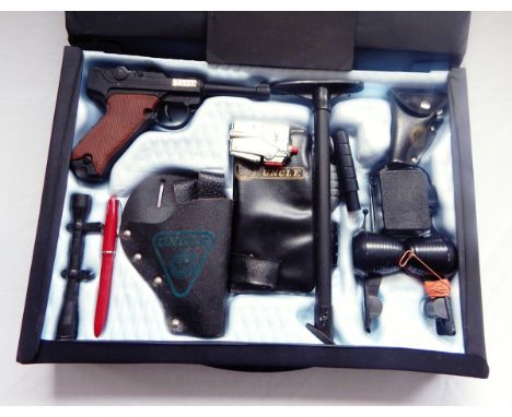 Attache case and contents of secret agent weapons for 'The Man from U.N.C.L.E.' containing replica gun and holster, wallet, '