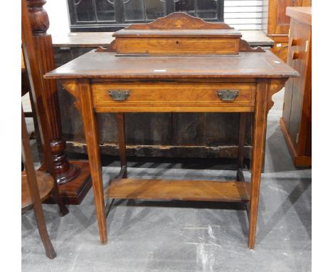 Edwardian rosewood lady's writing table, the top with stationery box, inset writing slope, long frieze drawer, with open shel