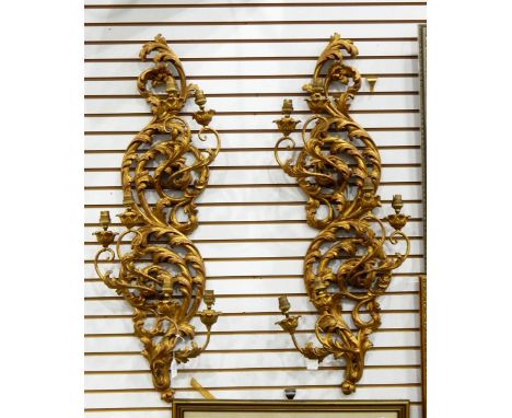 Pair of modern gilt wall lights of foliate scroll form, each with three pairs of scrolling branches with light fittings, appr
