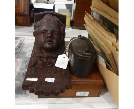 American humidor, a cast money bank marked 'Birmingham Municipal Bank' and a carved oak shelf supported by a cherub's face wi