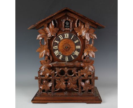 A late 19th century Black Forest softwood cased cuckoo mantel clock by Gordian Hettich Sohn, with brass two train movement st