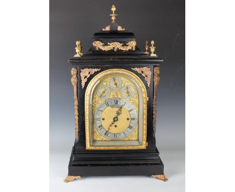 An impressive Victorian ebonized and brass mounted bracket clock with eight day triple fusee movement chiming quarters on eig