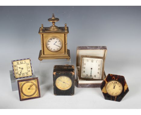 An early 20th century brass cased mantel timepiece with eight day movement, the silvered circular dial with Arabic hour numer