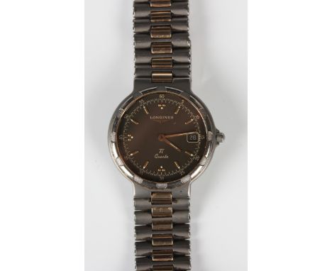 A Longines Ti Quartz Conquest titanium and gilt metal bracelet wristwatch, the signed dial with gilt baton and dot hour marke