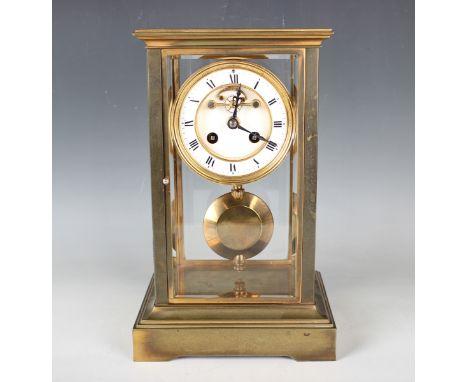An early 20th century French brass cased four glass mantel clock with eight day movement striking on a bell, the two piece en