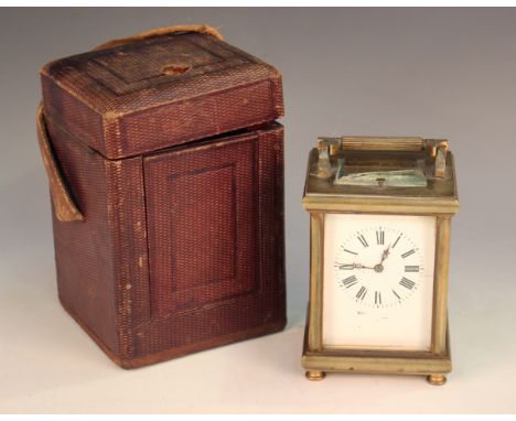 An early 20th century French brass cased carriage clock with eight day movement striking hours and half hours and repeating o