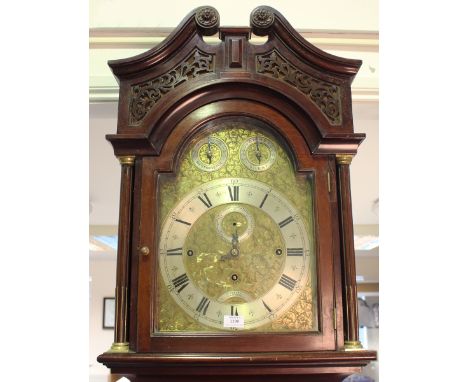 An impressive Edwardian mahogany longcase clock, the three train movement chiming quarters on eight tubular gongs and strikin