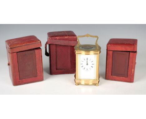 A 20th century lacquered brass cased carriage timepiece, the enamelled dial with Roman hour numerals and inscribed 'Made in E