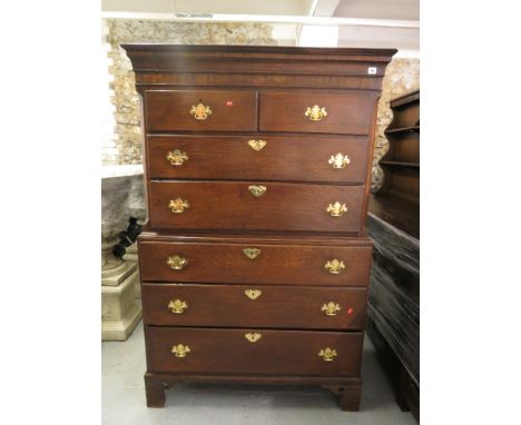A Georgian oak chest on chest having five long and two short drawers, standing on bracket feet, 67 x 43