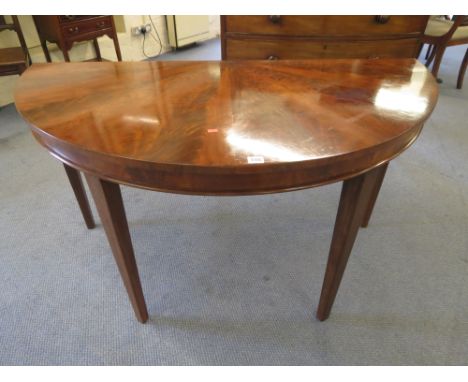 A 19th century mahogany demi-lune console table on square tapering legs