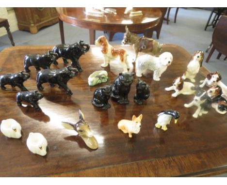 A selection of Sylvac pottery animals to include a Donkey, Old Sheep dog, along with Goebel animals and others