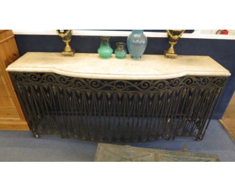 A 20th century faux marble top breakfront console on an ornate ironwork base