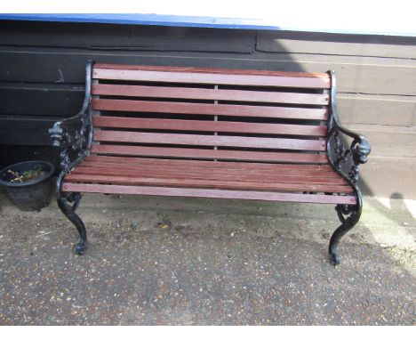 Bench with cast iron lion face ends