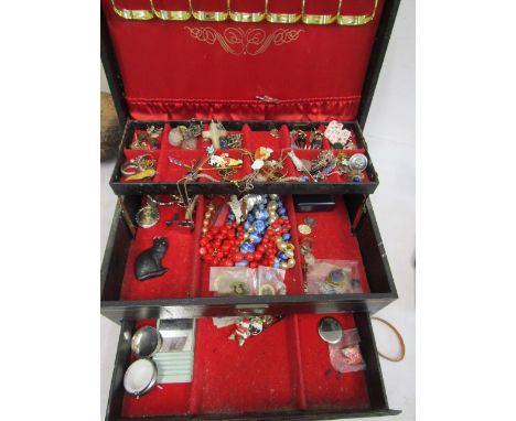 A jewellery box containing Lapis Lasuli ring, various costume jewellery, badges etc