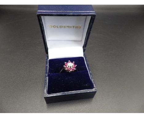 18ct hallmarked white gold, diamond and ruby 'flower ring' size N, 3.46g total weight