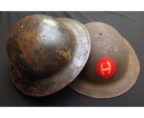 WW1 US Army issue steel helmet shells x 2. One with camo paint and the other with hand painted insignia to front. No liners o