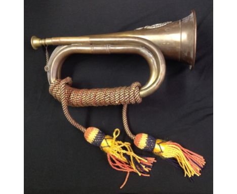 Brass and Copper Bugle complete with cords with a Rifle Brigade cap badge affixed. 