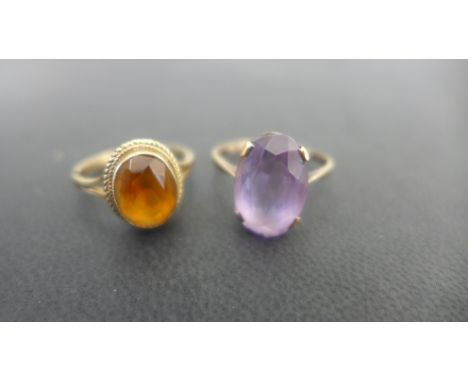 Two 9ct gold dress rings one set with amethyst - ring sizes M 1/2 and O - total weight approx 5.1 grams