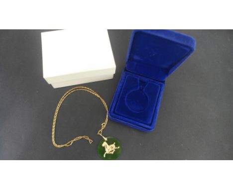 A jade and 14ct yellow gold Imperial Horse pendant and chain by Franklin Mint on a plated chain