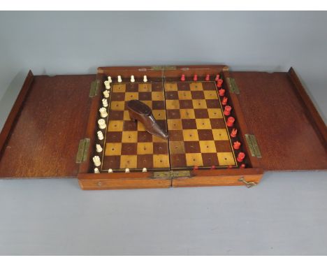 A mahogany travelling chess set with bone pieces - 8cm x 31cm x 15cm and a treen shoe snuff - chess set complete, some wear t