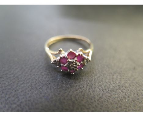 A 9ct gold diamond and ruby cluster ring size L - approx weight 2 grams - in good condition