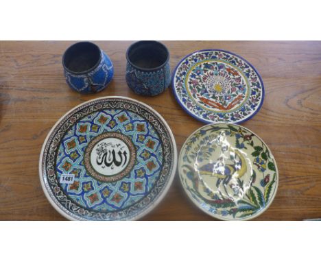 A Turkish Iznik design plate - Diameter 33cm - broken and repaired, two other plates - one chipped and two enamel pots