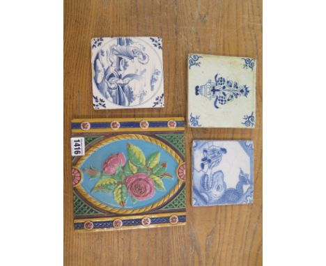Three Delft tiles - two 12.5cm x 12.5cm and one 13cm x 13.5cm and a Mintons Hollins and Co tile - 20cm x 20cm - all have chip