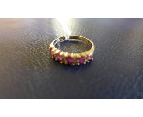 A 9ct gold ruby and diamond ring set with five marquise shaped rubies each separated by two small diamonds - weight approx 2.