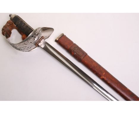 British George V 1897 Pattern Warrant Officers Sword, complete with its original brown leather field service scabbard and lea