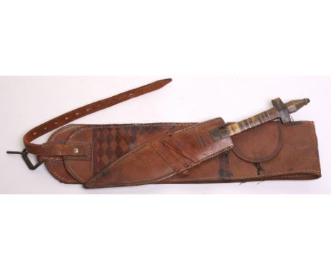 Interesting 1930’s Italian Colonial Police Somalia Natives Dagger housed in its original leather sheath attached to thick bro