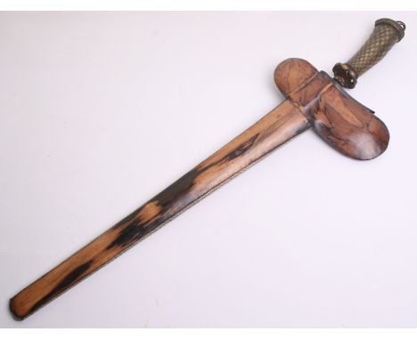 A Balinese Kris, straight black and silver coloured etched pamor blade 44cms, brass hilt engraved with a chequered pattern, i