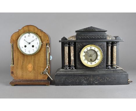 An Edwardian mahogany chequered strung eight day mantel clock, with French drum movement, white face and Arabic numerals toge