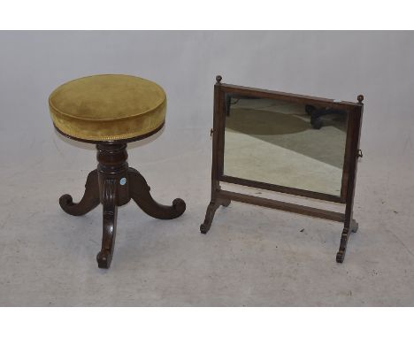 A Victorian mahogany circular piano stool, on splayed scroll tripod supports, 48cm high, and mahogany table top dressing mirr