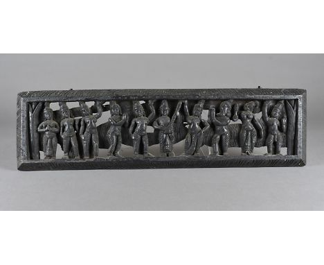 A stained carved wooden panel, depicting an Indian goddess playing sita surrounded by various female and male dancers, 17 cm 