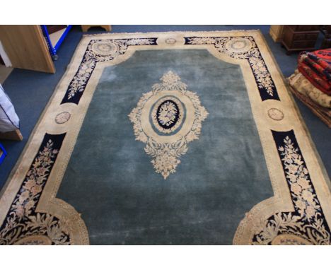 A large continental woollen carpet, central floral panel, with sky blue ground, and multiple boarders, 438 cm x 301 cm  