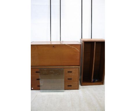 A 1960s ladder rack shelving unit, comprising two black wall mounts, a single shelf glazed display unit, three drawer chest, 