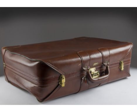 A vintage leather suitcase by Crouch & Fitzgerald, 66cm, some wear from usagesignificant scratch to the underside and scuffs 
