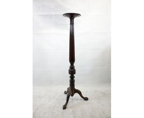 An Edwardian mahogany torchiere, tripod base with fluted column, 146 cm high 