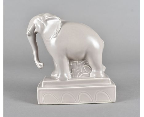 A Poole studio pottery model of an elephant, on a stepped plinth base, printed factory mark to base, 17 cm highOverall in ver