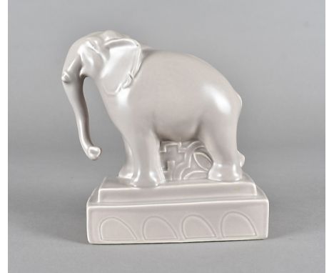 A Poole studio pottery model of an elephant, on a stepped plinth base, printed factory mark to base, 17 cm highOverall in ver