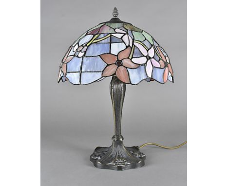 A Tiffany style desk lamp, the metal naturalistic base with glass shade, 51 cm high 